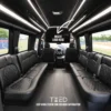 Luxurious black limousine interior featuring sleek black leather seats and elegant design elements.