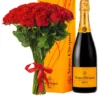 Red roses and champagne elegantly arranged in a yellow box, creating a romantic and luxurious gift presentation.